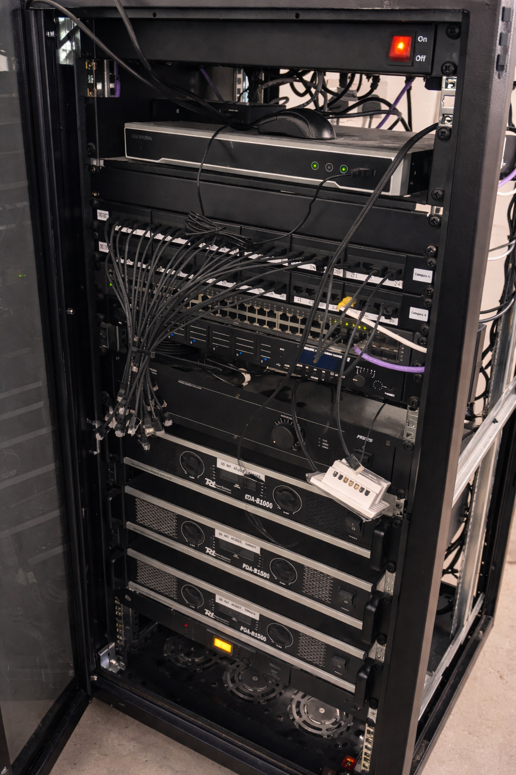 Data networking in London - network cabling rack installed by Find Electrician