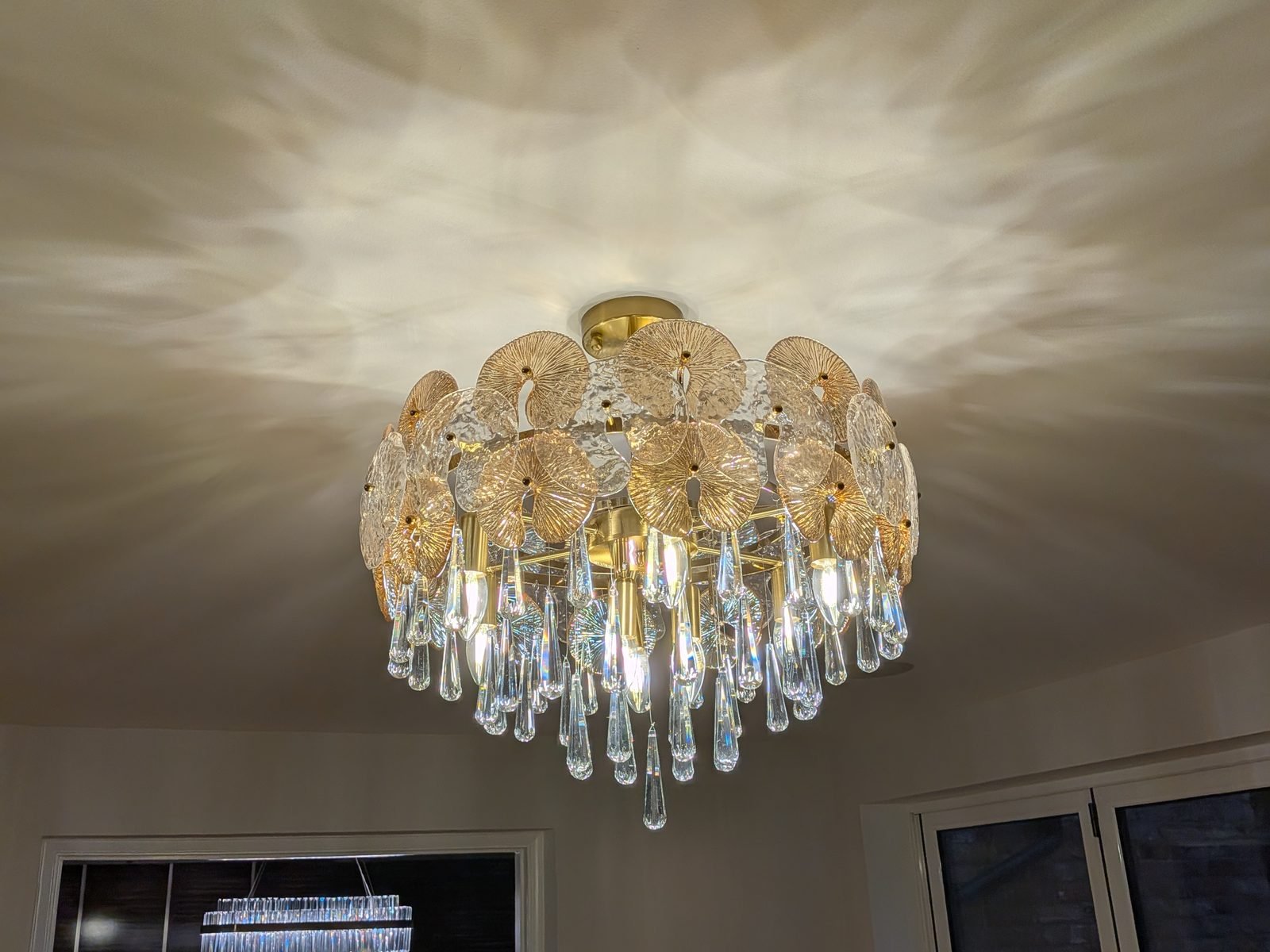 Light fitting repair in London - gold chandelier with glass discs and crystal drops